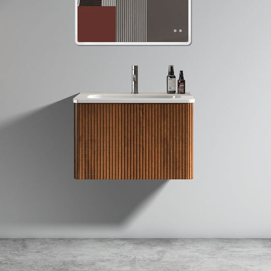 The Etna Striped Bathroom Vanity features vertical wood panels, a ceramic sink, and wall-mounted floating design. A white countertop holds toiletry bottles, and a minimalist mirror hangs above on the light gray wall.