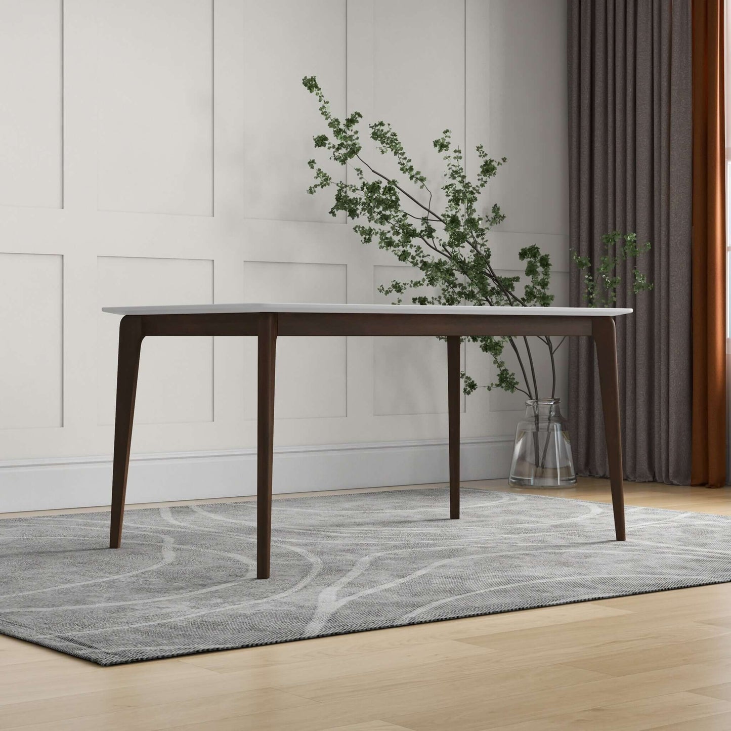 The Levi - Modern Style Rectangular Dining Kitchen Table with a white top stands on a gray patterned rug in a minimalist room with paneled walls, floor-length curtains, and a potted glass vase holding greenery.