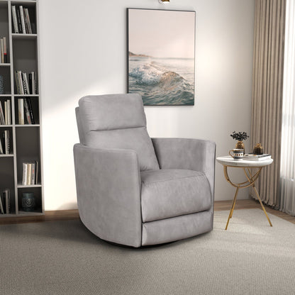 A modern living room features the Lawson Swivel Glider Suede Recliner Chair in Latte on a light carpet, a round white and gold side table with decor, a bookshelf, a large window with beige curtains, and seascape artwork on the wall.