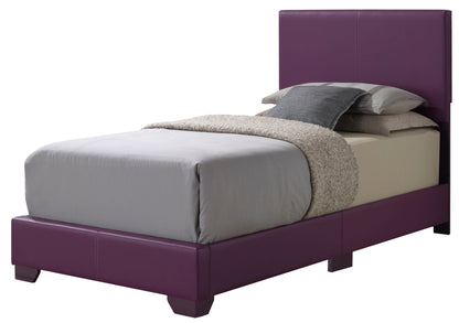 The Elegant Platform Bed For Relaxed Spaces features a purple upholstered frame and headboard, light gray bedding, a beige blanket, and layered gray and beige pillows for a modern look.