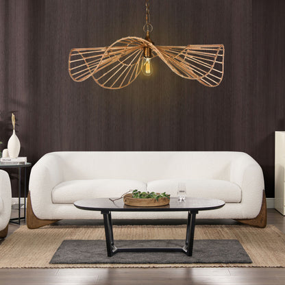 A modern living room featuring the Alpine Luxurious Upholstery Sherpa Sofa, paired with a black oval coffee table, textured brown area rug, and a sculptural rattan pendant light against a dark wood-paneled wall.