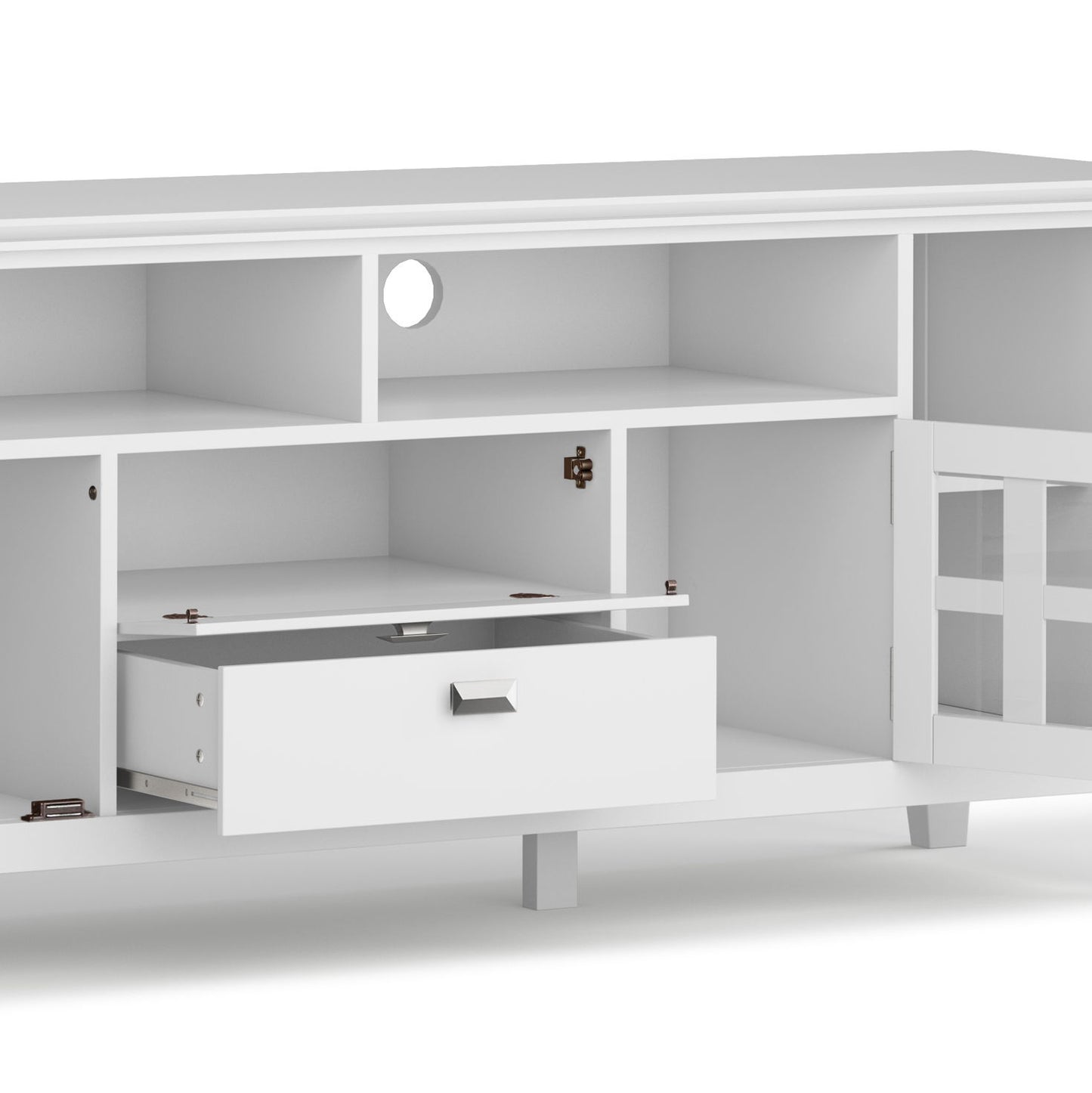 The Artisan - TV Media Stand is white with open shelves, a drawer, and cabinet doors; one cabinet door and the drawer are partly open, revealing storage inside. A circular cable management hole is located at the back.