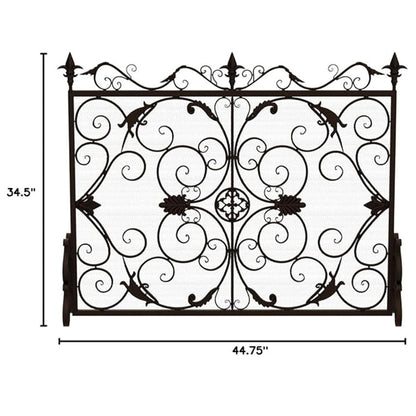 The Darcie Wrought Fireplace Screen features an ornate design with intricate scrollwork and leaf motifs. It measures 34.5" tall by 44.75" wide, perfect for adding elegance to your hearth.