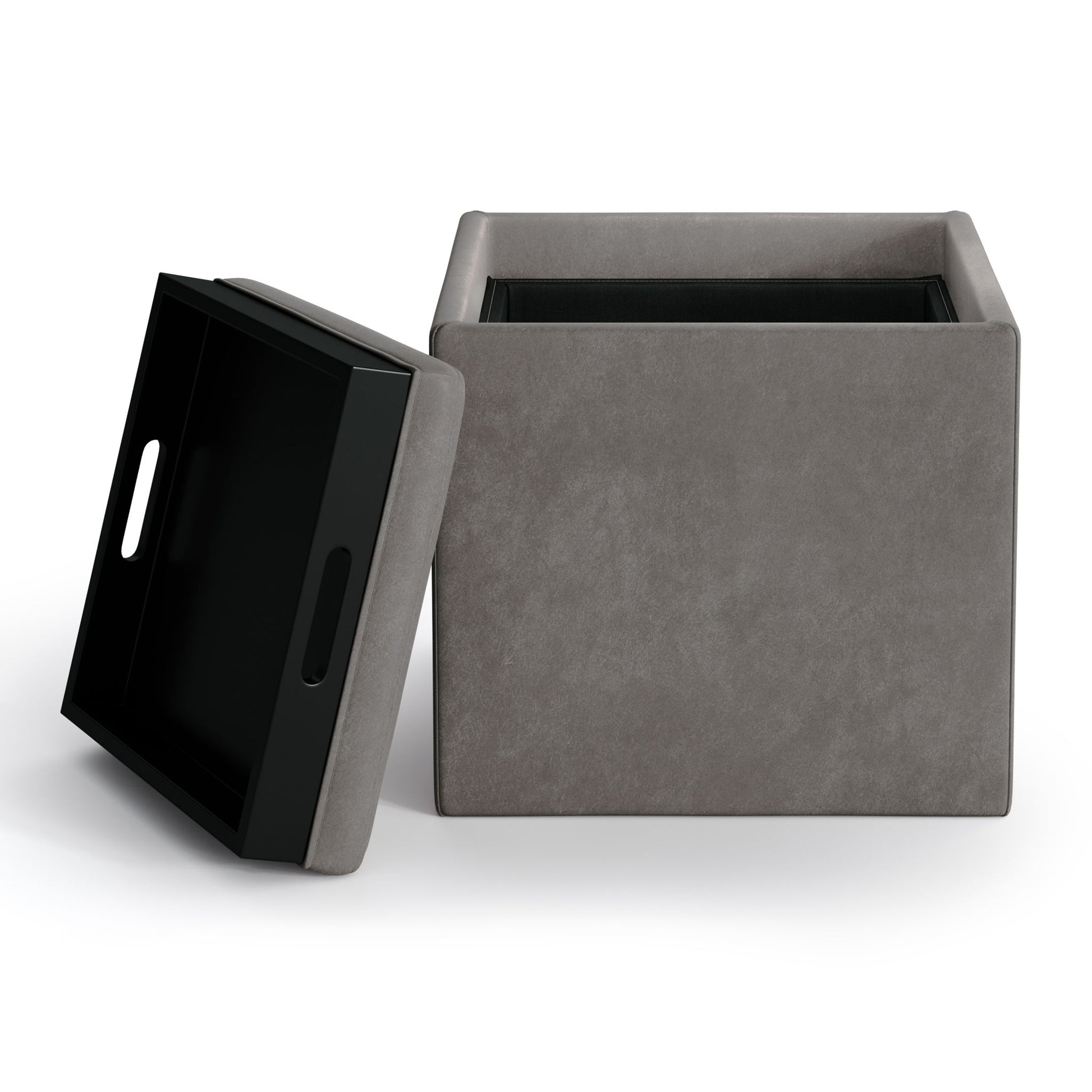 The Rockwood Upholstered Cube Storage Ottoman With Tray is a square, gray ottoman with a removable lid featuring cutout handles and a tray. When lifted, the lid reveals a black storage compartment inside. Shown against a plain white background.