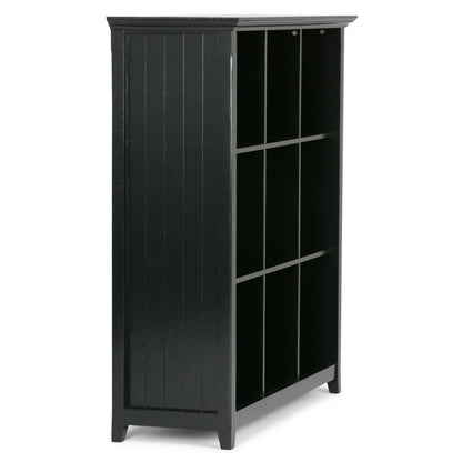 The Acadian - Handcrafted Cube Storage is a black wooden bookshelf with three shelves, each featuring three cubbyhole compartments, standing on four legs.