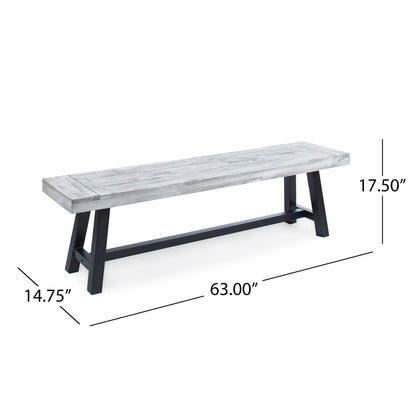 The Tranquilizer Outdoor Acacia Wood Bench features a light gray finish, black legs, and a modern minimalist slat panel design. It measures 63"L x 14.75"D x 17.5"H, making it perfect for contemporary outdoor spaces.