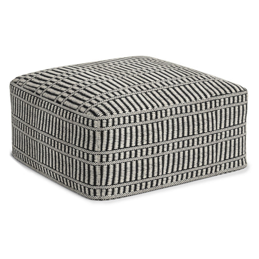 The Safford Square Woven Outdoor/Indoor Pouf in black and white features a geometric pattern with horizontal and vertical stripes and a soft, cushioned top.