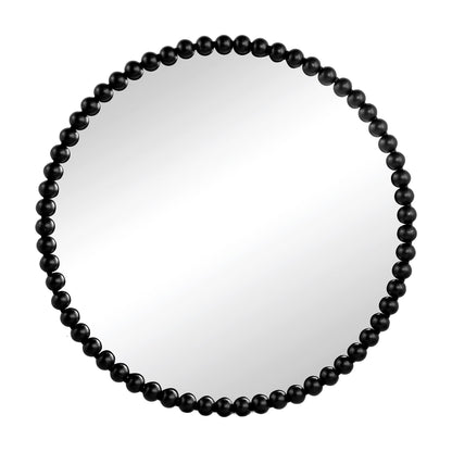 The Circle Mirror With Metal Beaded Frame features evenly spaced black metal beads around a round mirror, perfect for living rooms, bedrooms, or entryways. Set against a white background for a classic look.