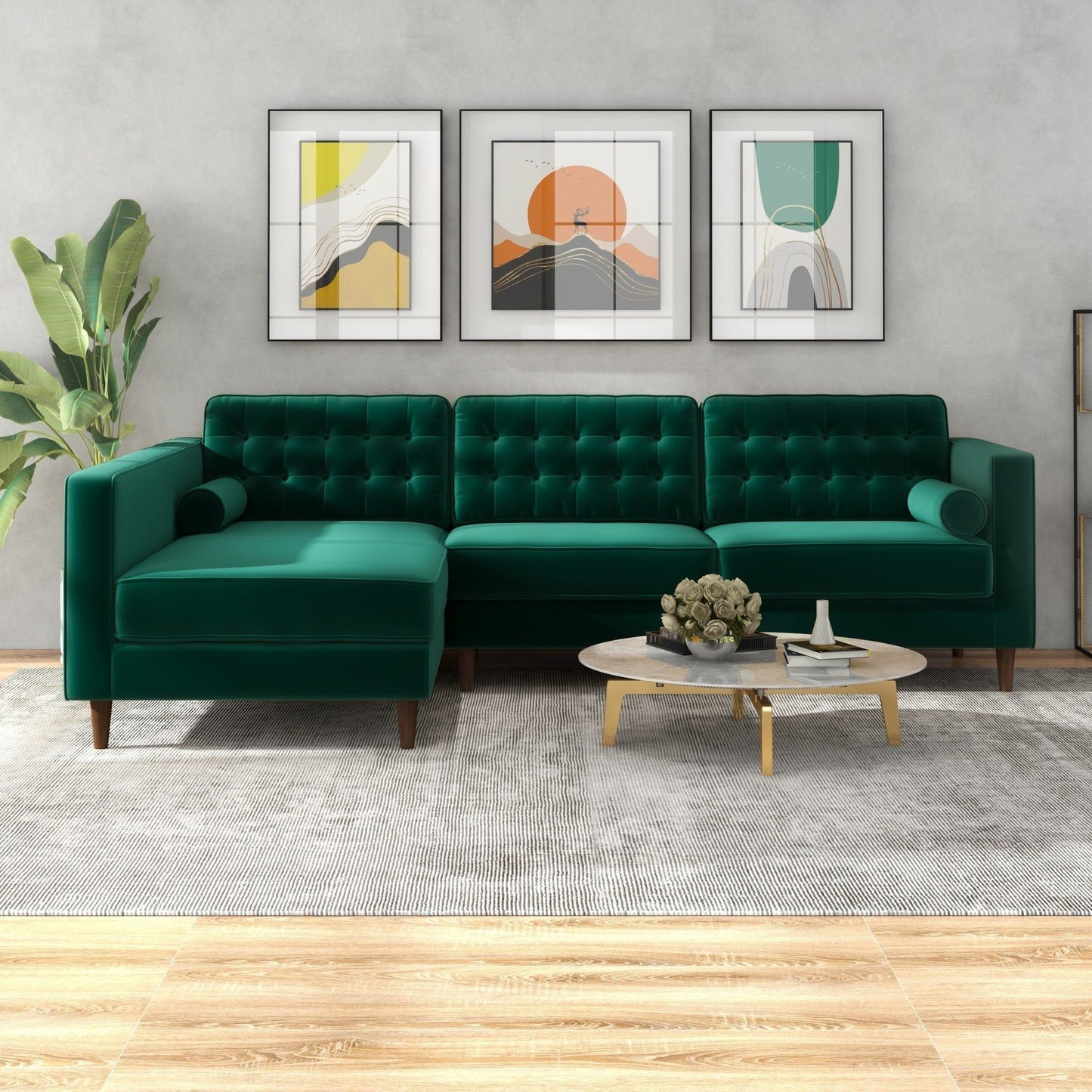 Modern living room with the Christian Mid-Century Modern Design Sectional Sofa in green velvet, a round coffee table, gray rug, potted plant, and three abstract art prints on a light gray wall.