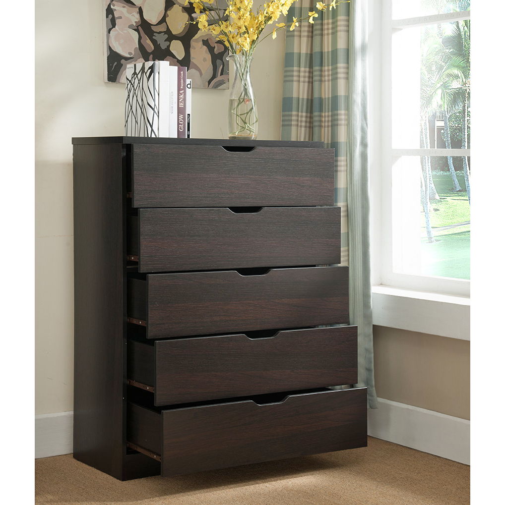 A Modern Drawer Chest and Clothes Storage Cabinet with metal drawer glides stands by a window with plaid curtains. On top are a vase of yellow flowers and books, with a decorative canvas displayed on the wall behind.