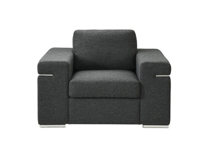 The Gianna Fabric Arm Chair features a modern dark gray design with wide armrests, rectangular cushions, and metal legs, shown from the front against a white background.