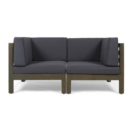 The Oana 2 Piece Loveseat Set features water-resistant dark gray cushions and a simple wooden frame, shown against a white backdrop.