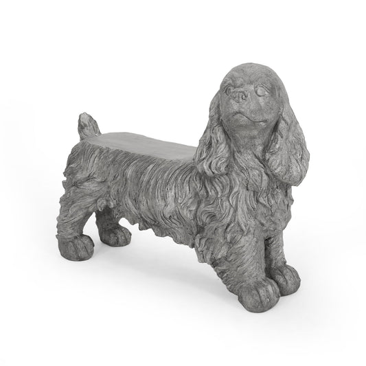 The Cocker Spaniel Dog Statue - Gray is a bench styled as a shaggy dog with long ears, sculpted to resemble stone. The seat is flat on the dog's back, and the figure stands firmly on all four legs.