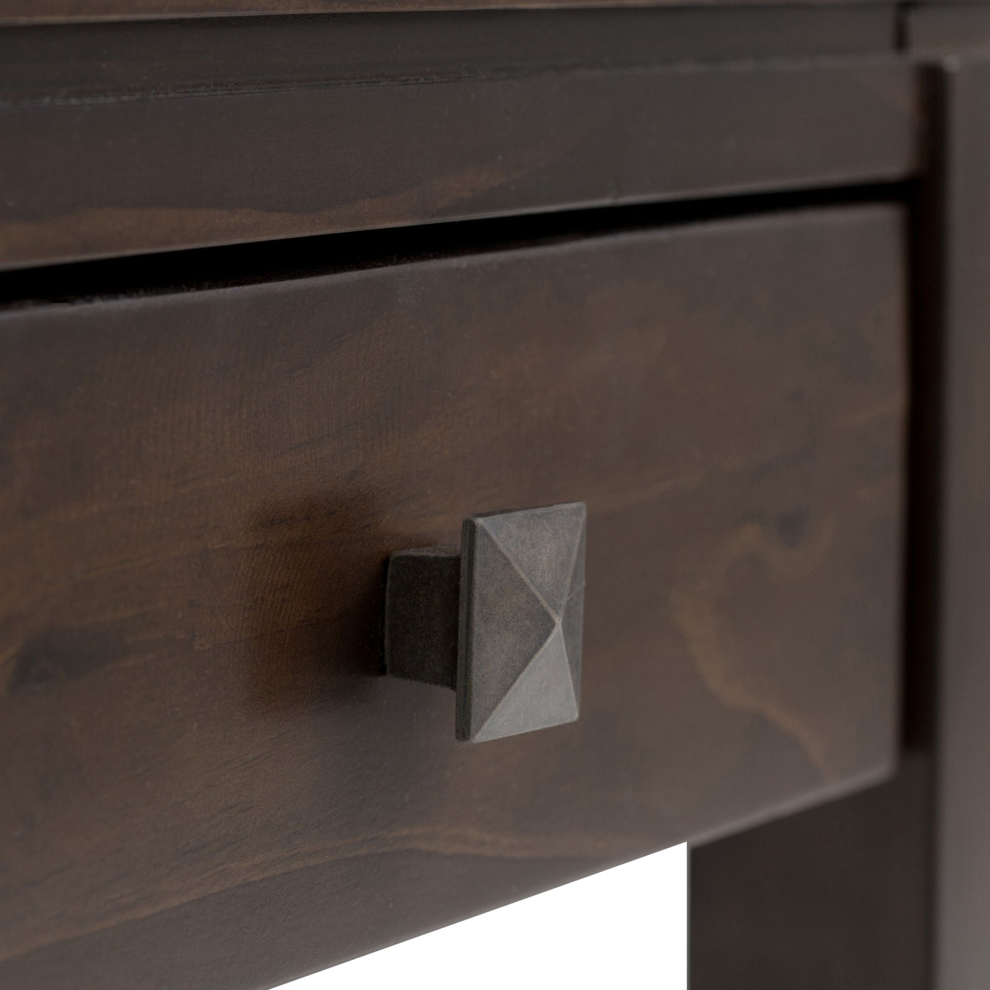 Close-up of the Cosmopolitan - Multipurpose Table’s dark wood drawer, highlighting the grain, texture, and its square geometric metal knob.
