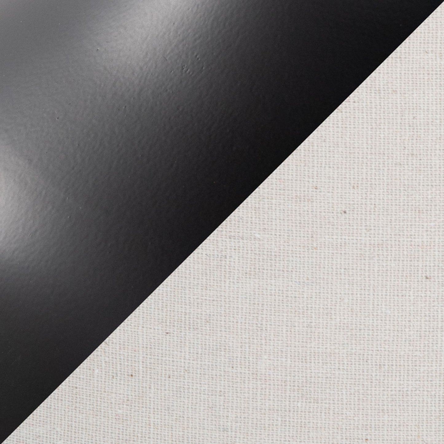 A diagonal split image showcases the Genie - Contemporary Table Lamp (Set of 2) in Matte Black, featuring a smooth, matte black finish on the upper left and textured oatmeal canvas fabric on the lower right.