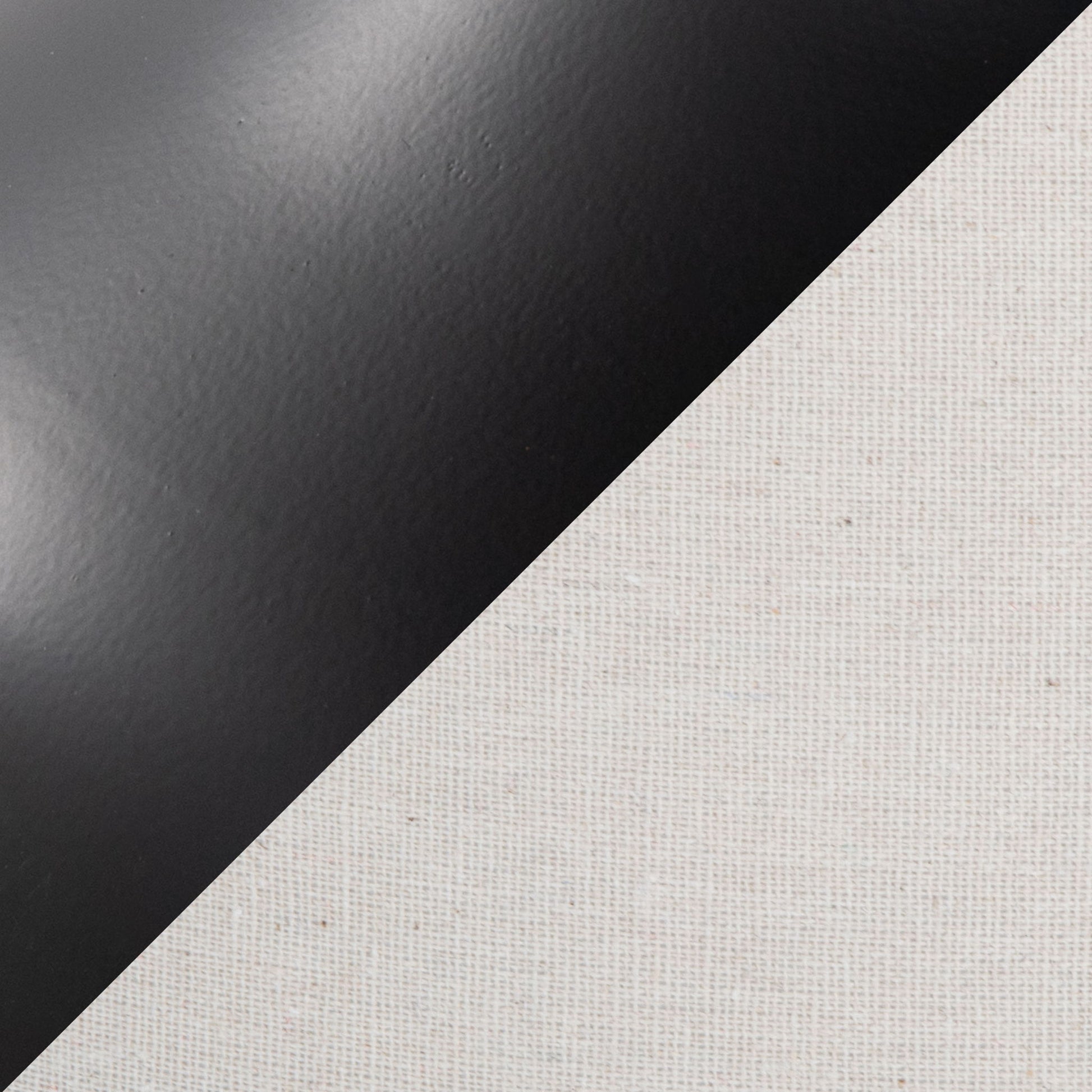 A diagonal split image showcases the Genie - Contemporary Table Lamp (Set of 2) in Matte Black, featuring a smooth, matte black finish on the upper left and textured oatmeal canvas fabric on the lower right.