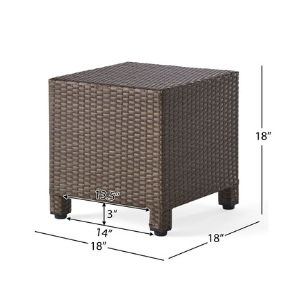 The Puerta Minimalist Style Accent Table is a square brown wicker outdoor table with four short 3-inch legs, measuring 18" H x 18" W x 18" D, featuring a 14" front and a 13.5" space between the legs.