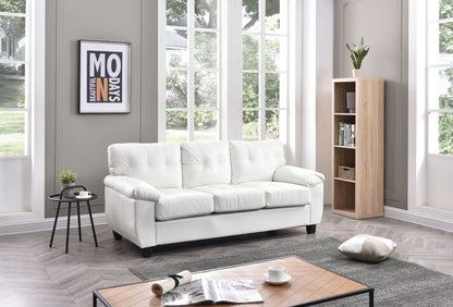 A bright, modern living room with large windows features the Comfortable Sofa in white, a wooden bookshelf with a plant, a side table holding a black cup, and a coffee table displaying an open magazine with a cushion on the floor.