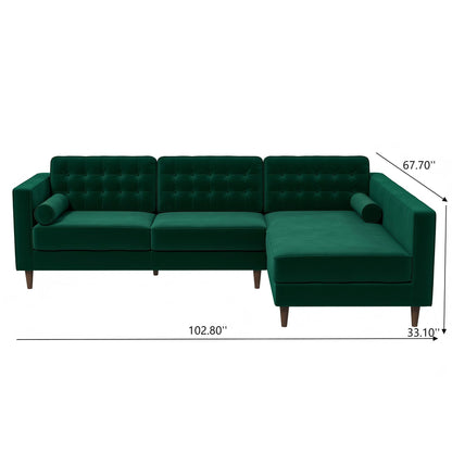 The Christian Mid-Century Modern Sectional Sofa features a dark green L-shape, tufted backrest, two cylindrical pillows, and dark wooden legs. Dimensions: 102.8"W x 67.7"D (chaise) x 33.1"D (seat section).