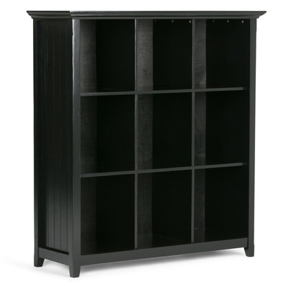 The Acadian - Handcrafted Cube Storage is a black wooden shelving unit with nine open cubby compartments in a 3x3 layout, featuring a simple, modern design, flat top, and decorative side panels.
