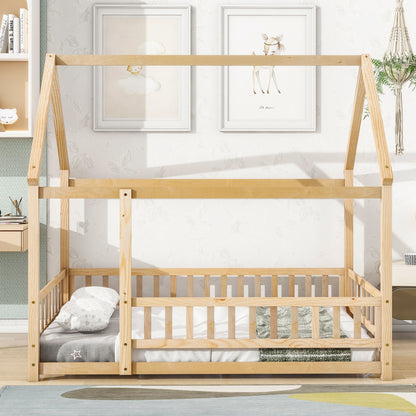 The Floor Wooden Bed With House Roof Frame and Fence Guardrails stands in a bright room with a low mattress, pillows, and blanket. Two animal prints hang above the bed, surrounded by playful children’s decor.