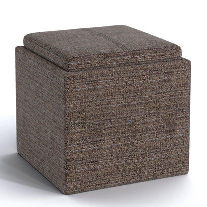 The Rockwood Upholstered Cube Storage Ottoman With Tray is a square, brown, fabric ottoman featuring a cushioned lid and modern design, shown on a white background.