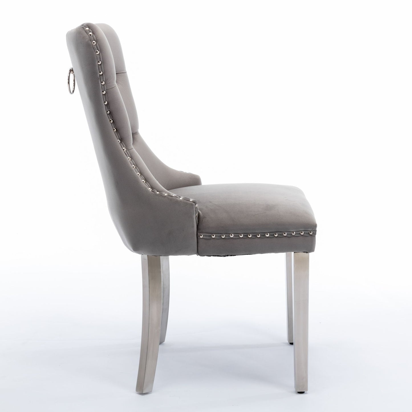 Side view of the Nikki modern high-end tufted velvet dining chair, featuring chrome stainless steel legs, solid wood frame, nailhead trim, and contemporary design on a white background (set of 2).