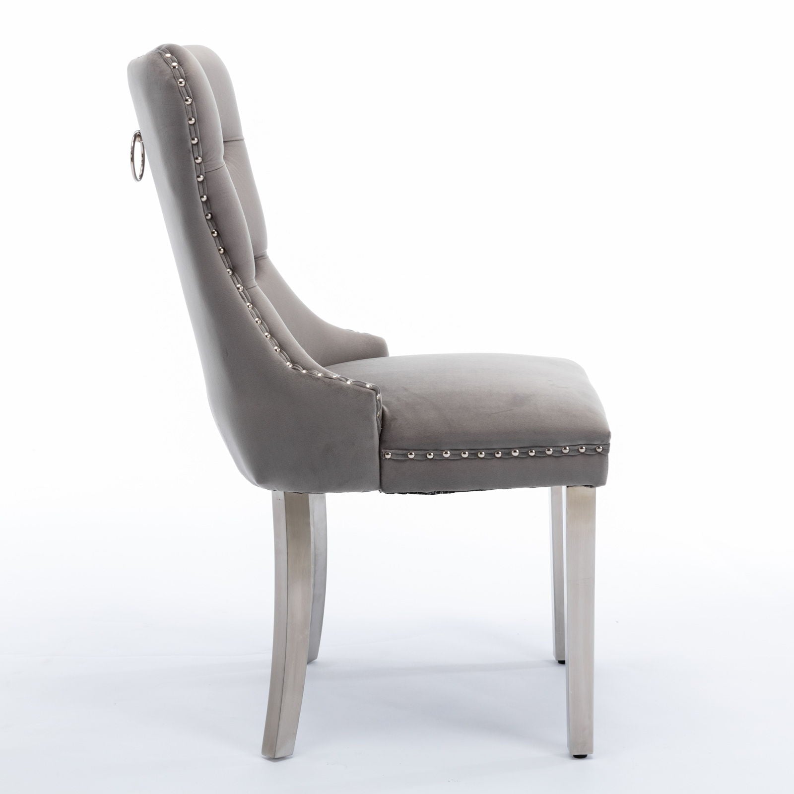 Side view of the Nikki modern high-end tufted velvet dining chair, featuring chrome stainless steel legs, solid wood frame, nailhead trim, and contemporary design on a white background (set of 2).
