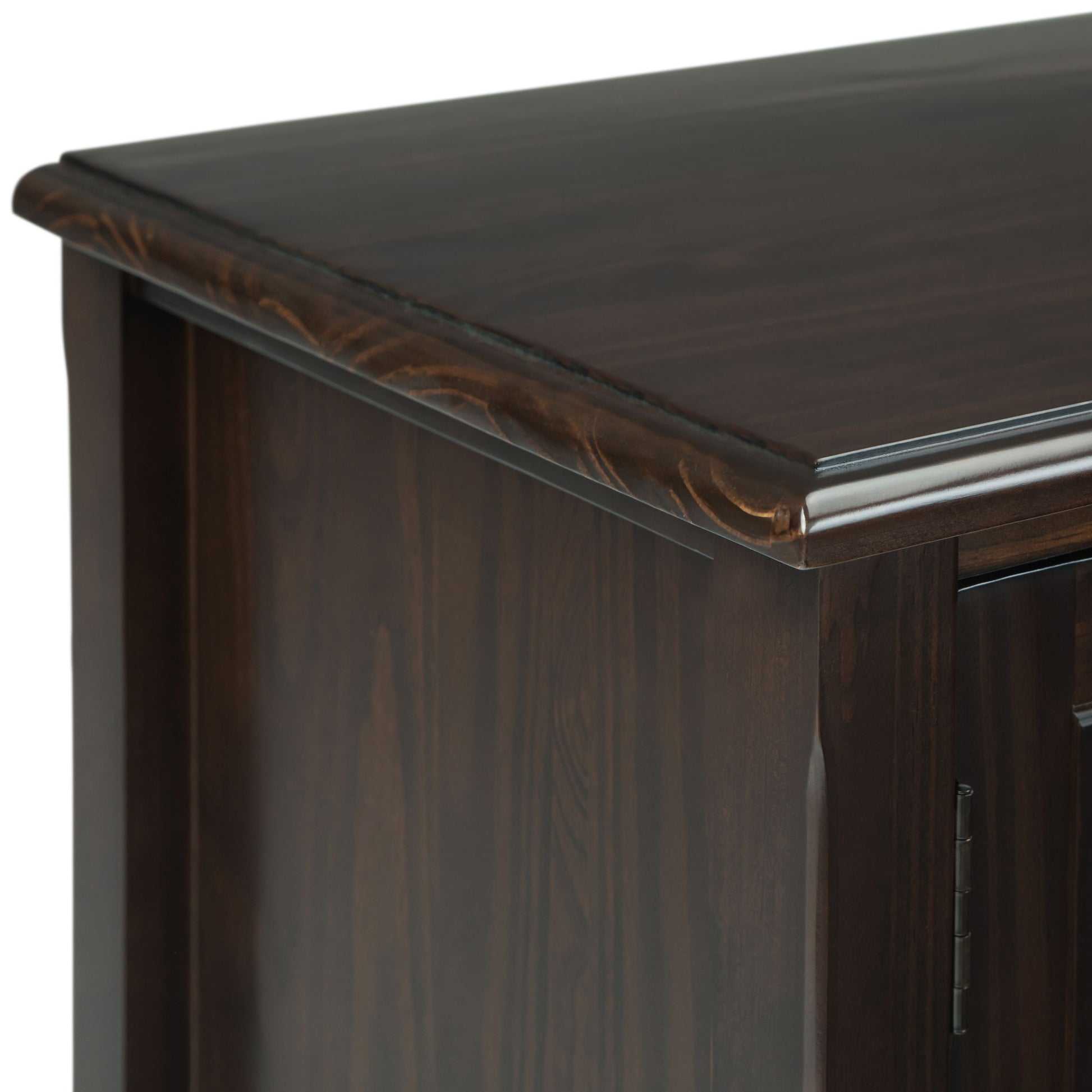 Close-up of the top corner of the Burlington - TV Media Stand, featuring a smooth polished dark wood surface, subtle grain patterns, and elegant decorative trim along the edge.