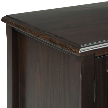 Close-up of the top corner of the Burlington - TV Media Stand, featuring a smooth polished dark wood surface, subtle grain patterns, and elegant decorative trim along the edge.