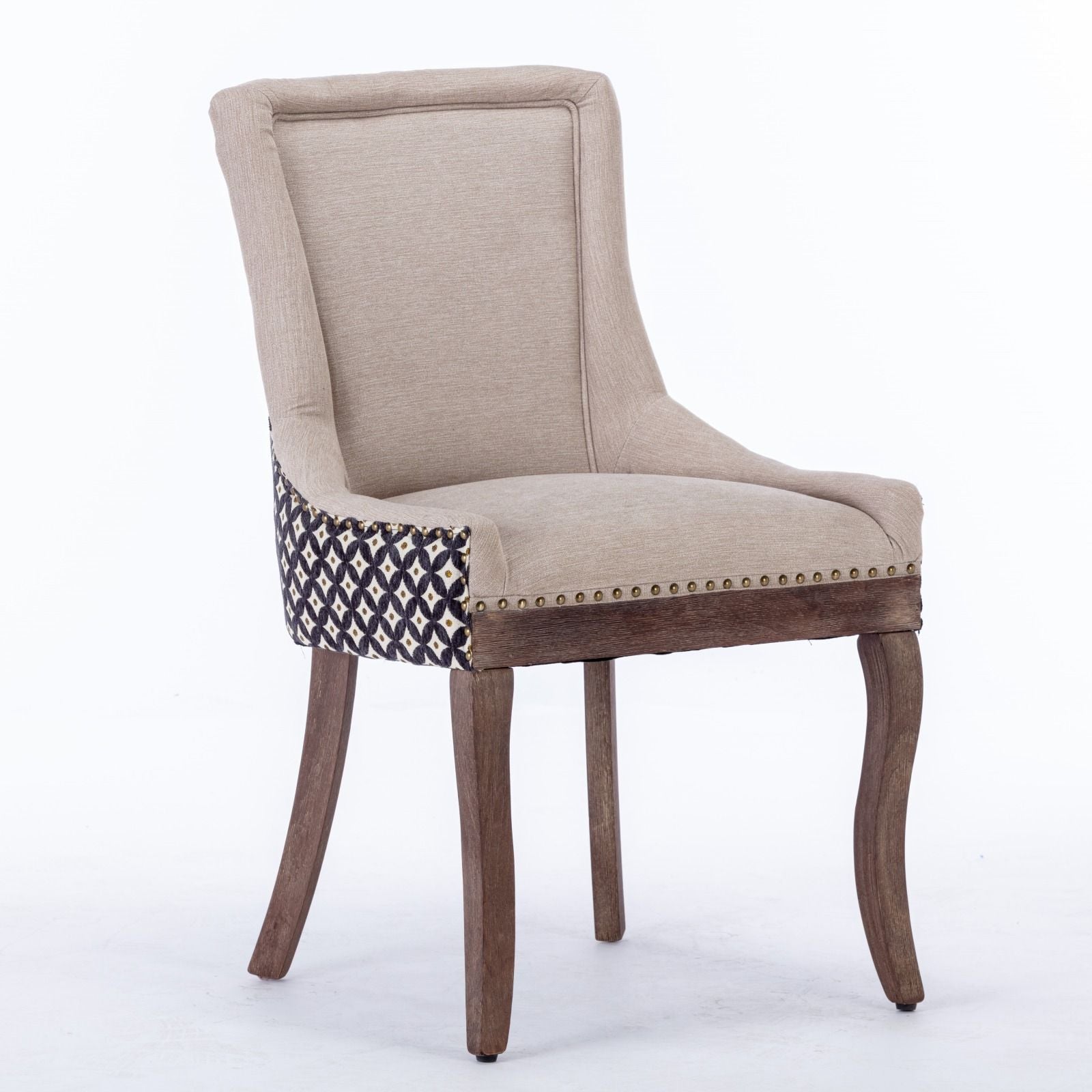 The Ultra Side Dining Chair set features beige upholstery, neutrally toned solid wood legs, and bronze nailhead trim. Black and white geometric patterned fabric accents the sides and back. Set of 2, shown against a white background.