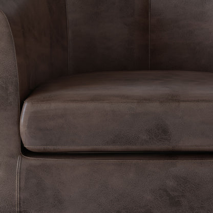 Close-up of the Austin - Handcrafted Tub Chair in dark brown leather, highlighting the seat cushion, backrest section, and one armrest with detailed texture and stitching.