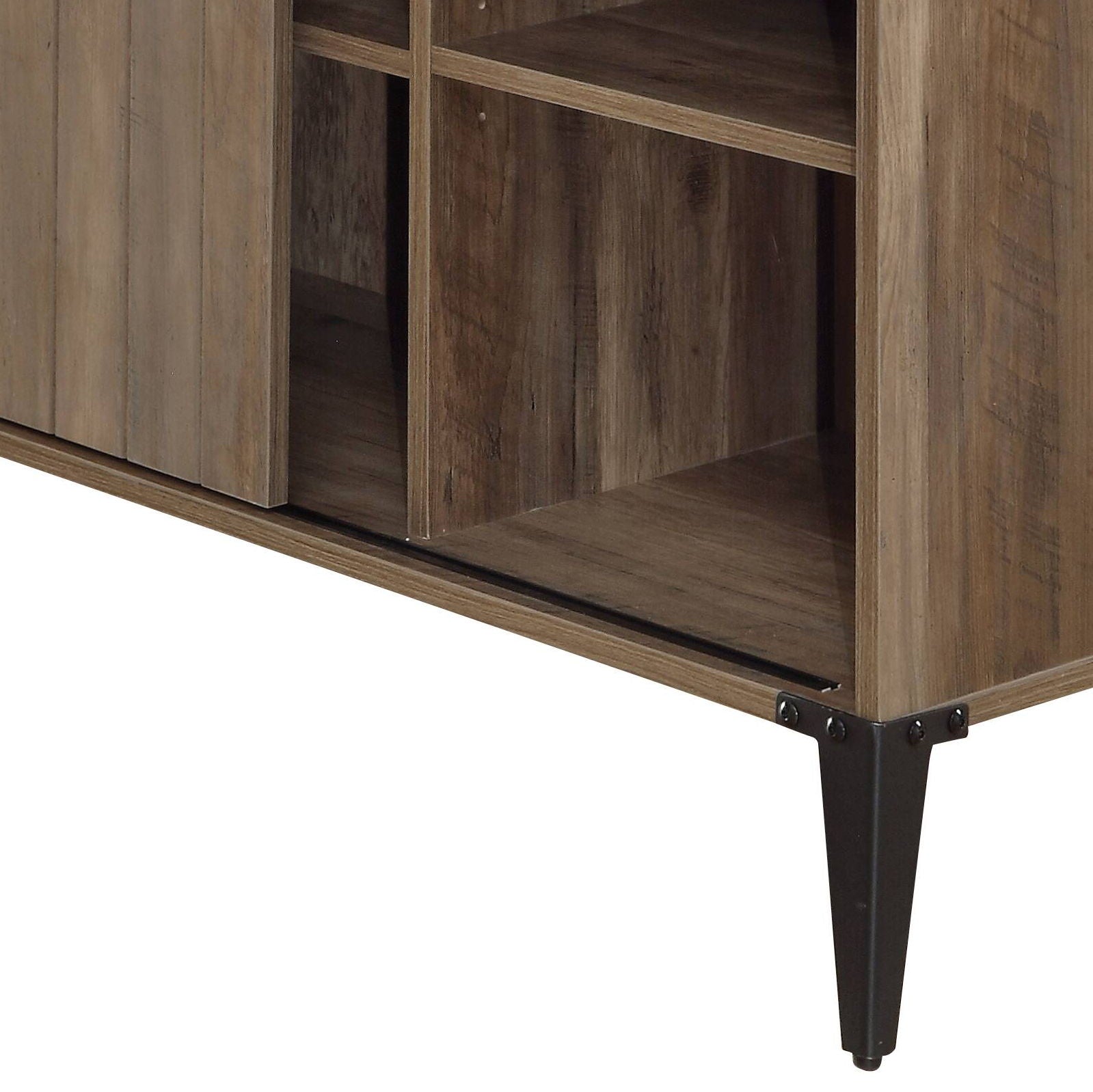 A close-up of the Zakwani Writing Desk highlights its open shelves, dark metal legs, visible wood grain texture, and sturdy construction.
