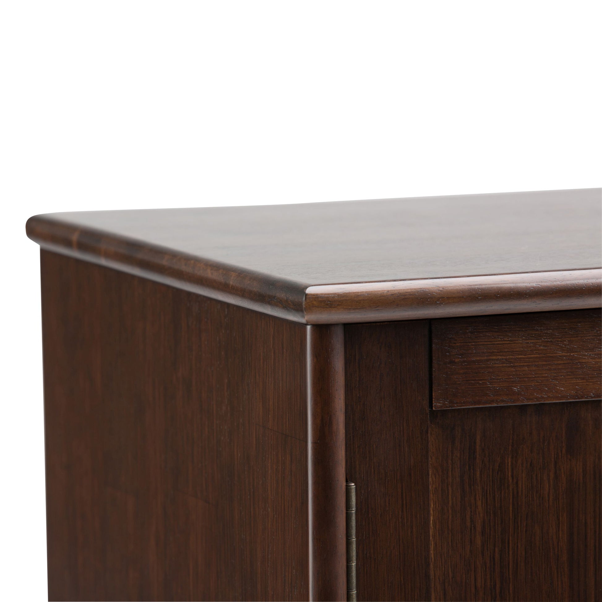 Close-up of the top corner of the Draper - Mid Century Sideboard Buffet And Wine Rack in medium auburn brown, featuring a smooth finish and rounded edges.