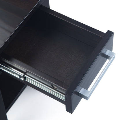 An overhead view of an open, empty dark wood drawer with a silver handle, part of the Kitchener - Handcrafted Table, shown against a white background.
