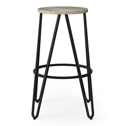 The Simeon Multifunctional Metal Stool features a round wooden seat, black metal legs, and a circular footrest for added support.