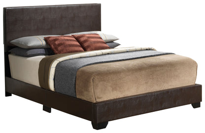 The Elegant Platform Bed For Relaxed Spaces features a dark brown upholstered frame and headboard, neutral bedding, a gray blanket, and pillows in brown, white, and gray tones.