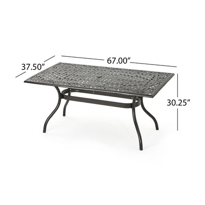 The Celestine Outdoor Cast Aluminum Dining Table features a floral lattice design, curved legs, and an umbrella holder. Dimensions: 67"L x 37.5"W x 30.25"H.