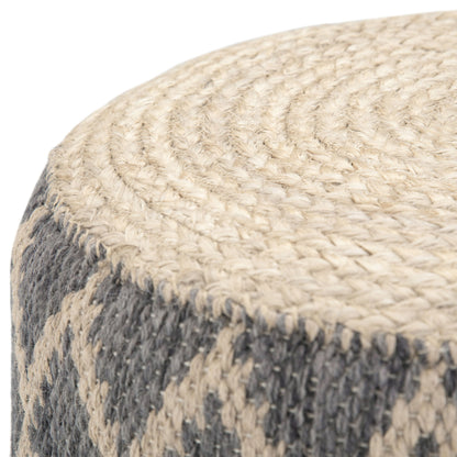 Close-up of the Edgeley - Handcrafted Round Pouf, featuring natural beige and gray fibers with a coiled textured top and diamond-patterned sides.
