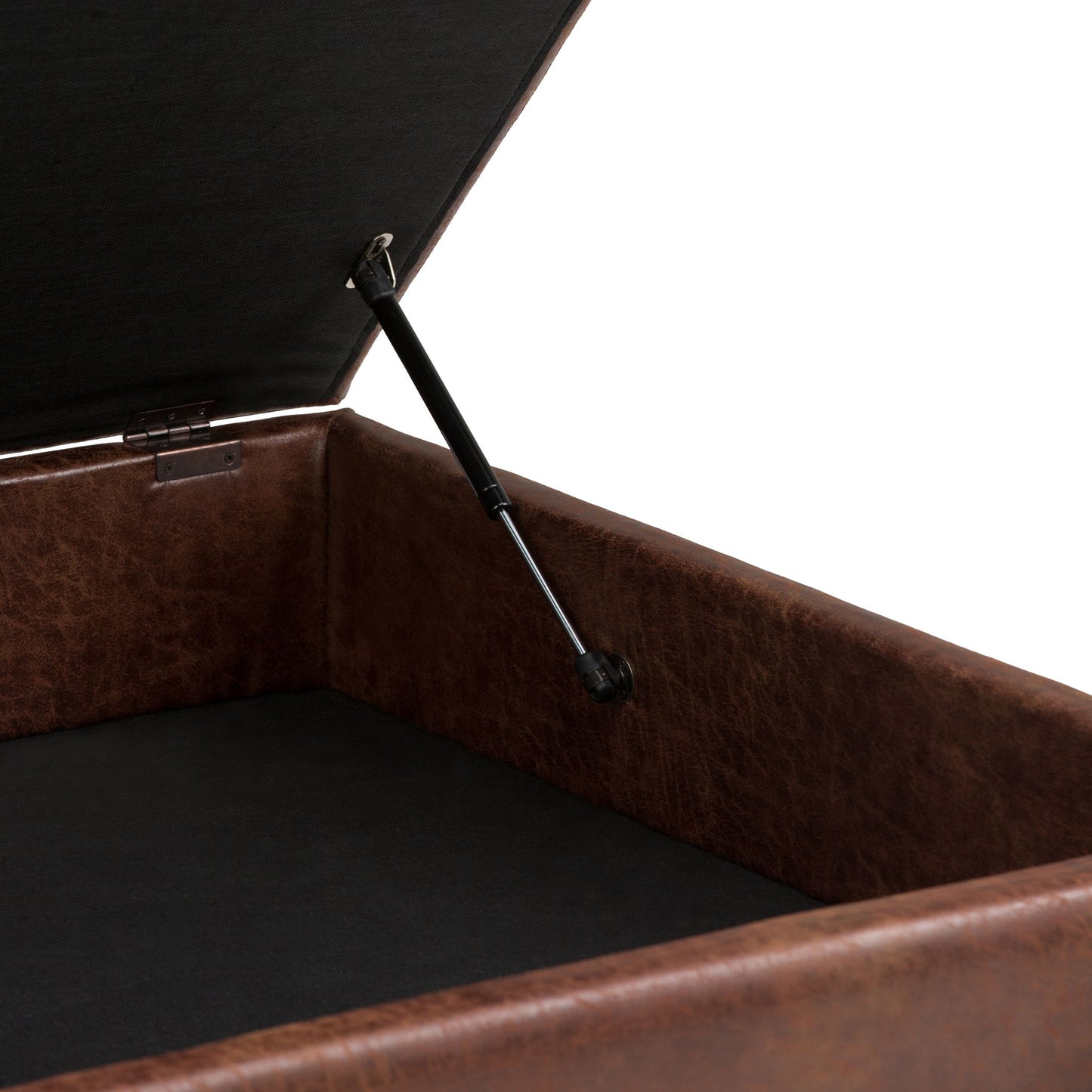 A close-up of the Owen Multifunctional Square Coffee Table Storage Ottoman reveals its open brown leather exterior, black interior, hinge mechanism, and gas lift support that securely holds the lid open.