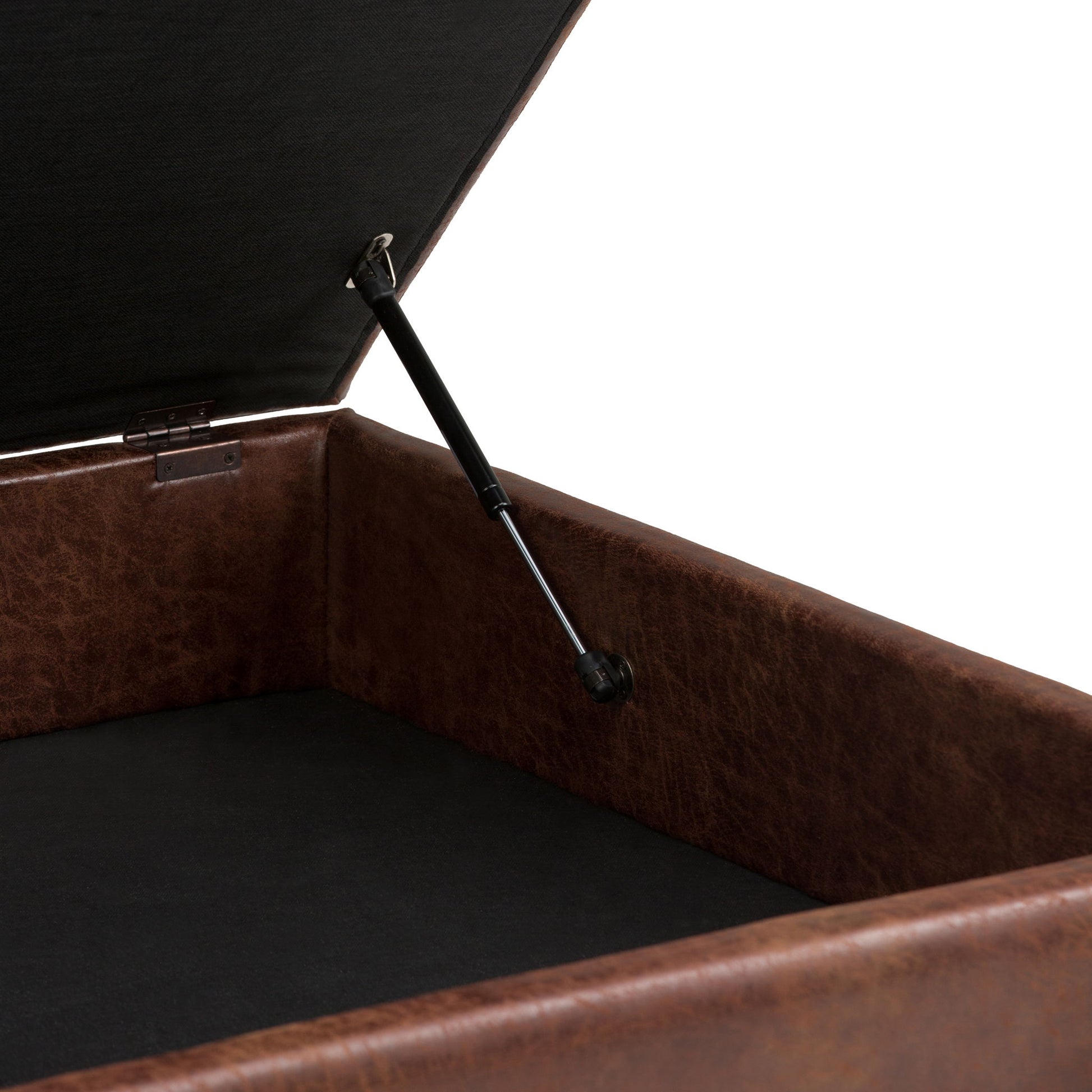 A close-up of the Owen Multifunctional Square Coffee Table Storage Ottoman reveals its open brown leather exterior, black interior, hinge mechanism, and gas lift support that securely holds the lid open.