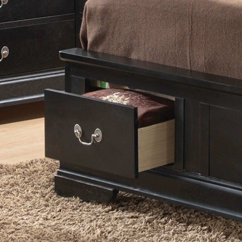 A close-up of the Louis Phillipe - Storage Bed shows its black wooden frame with a partially open footboard drawer revealing a folded blanket inside. The bed is covered with a brown blanket and rests on a beige carpet.