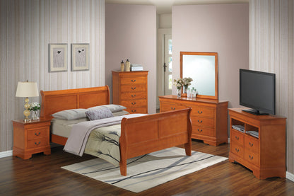 A bedroom featuring the Panel Sleigh Bed, two nightstands, a dresser with mirror, a tall chest of drawers, and a TV on a stand. Patterned wallpaper and a light rug complete the neatly arranged space.