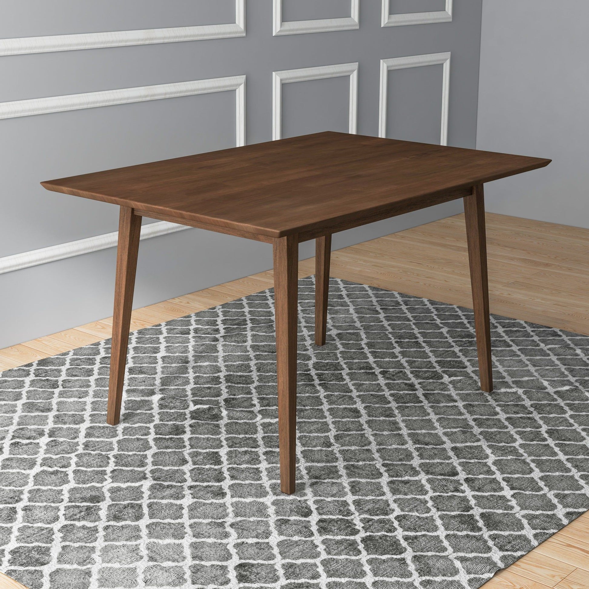 The Levi - Modern Style Rectangular Dining Kitchen Table with angled legs is placed on a patterned gray and white rug in a room featuring light wood floors and gray walls with white trim.