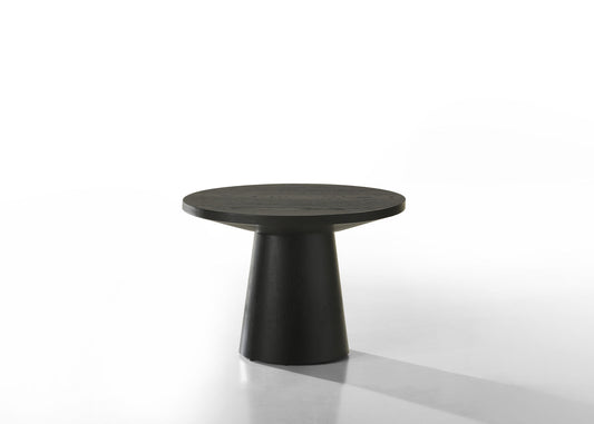 The Jasper - Round Table features a modern black design with a thick, flat round top and a wide, tapered cylindrical base, displayed against a plain white background.