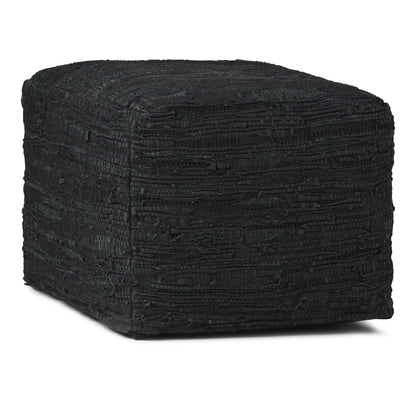 The Fredrik - Handcrafted Square Pouf is black, square-shaped with a textured surface and slightly rounded corners, displayed against a white background.