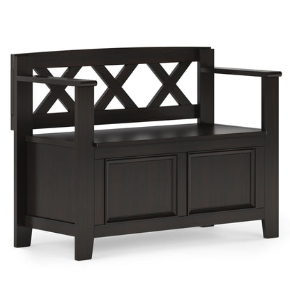 The Amherst Small Transitional Entryway Storage Bench features a dark wood finish, a decorative X-backrest, armrests on both sides, and a storage compartment under the seat.