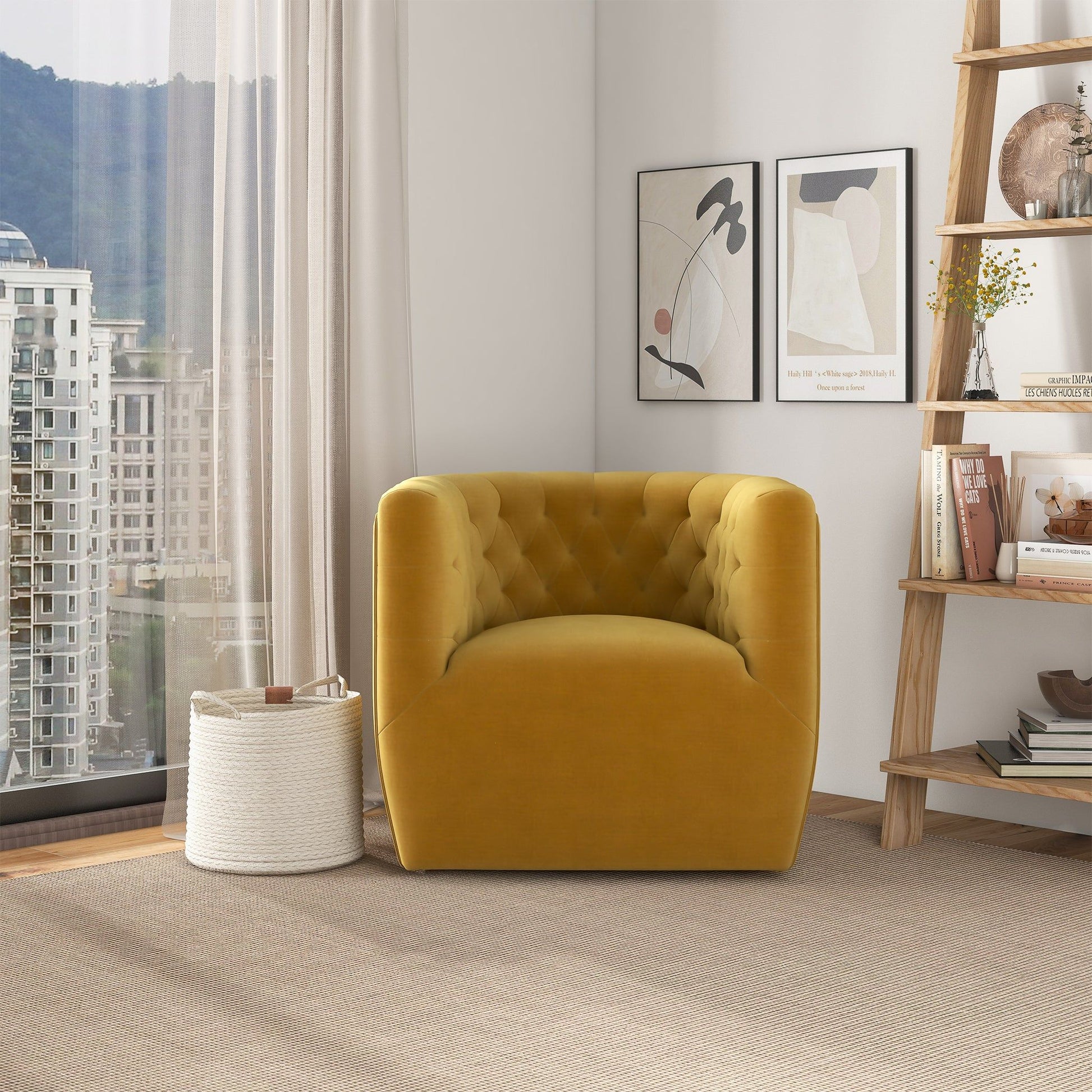 A modern living room featuring the Delaney Ergonomic Design Swivel Chair in mustard yellow, a white woven basket, a wooden shelf with books and decor, two abstract art prints on the wall, and large windows overlooking city buildings and trees.