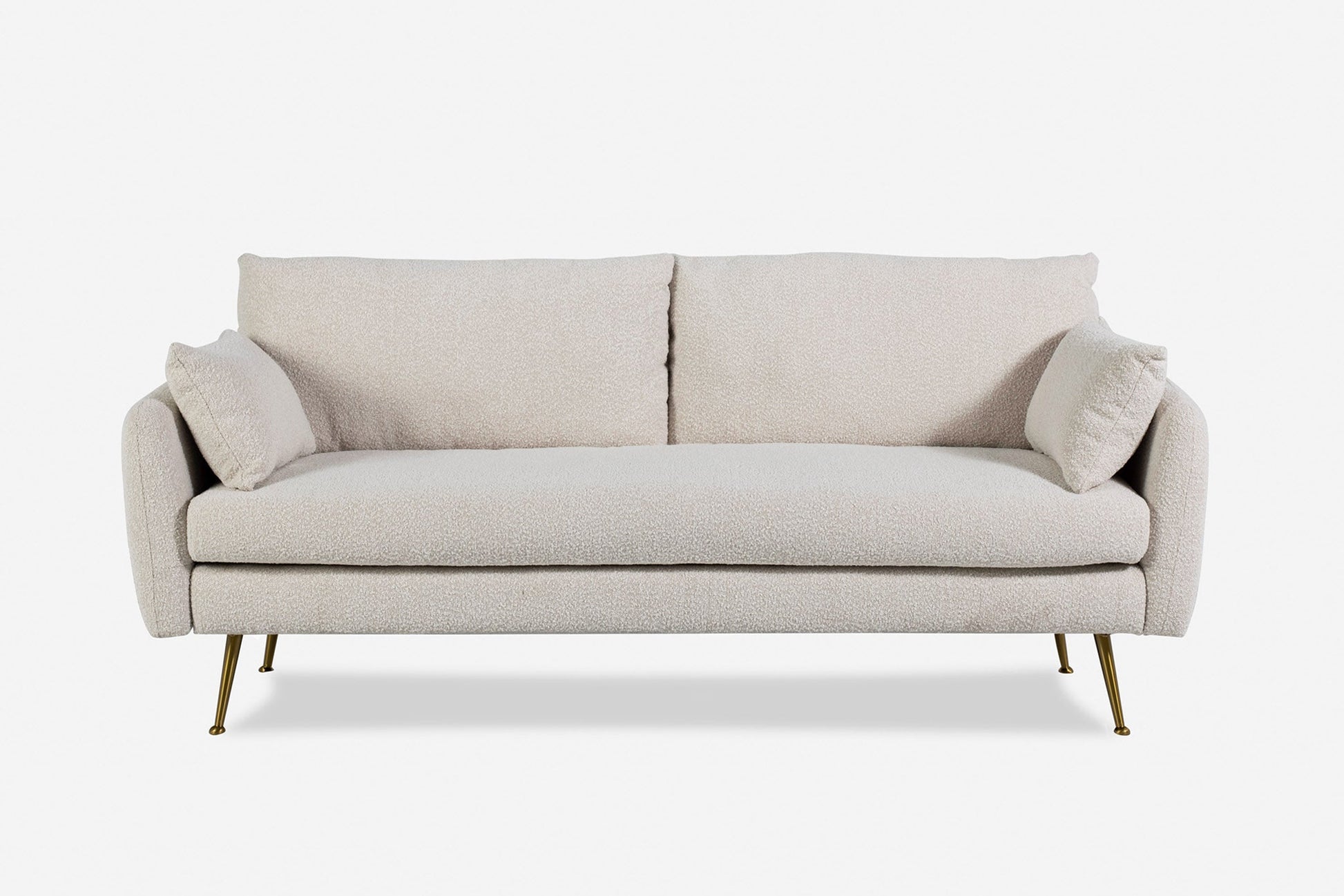 Park Sofa in beige features two back cushions, two side pillows, and slim gold metal legs, displayed against a plain white background.