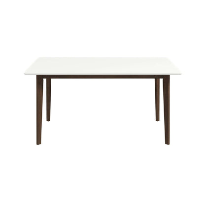 The Carlos Dining Table features a smooth white tabletop and four tapered, dark wooden legs, displayed against a plain white background.